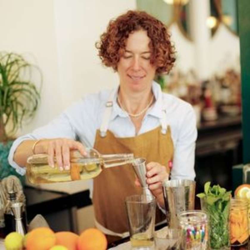 Diana making a cocktail