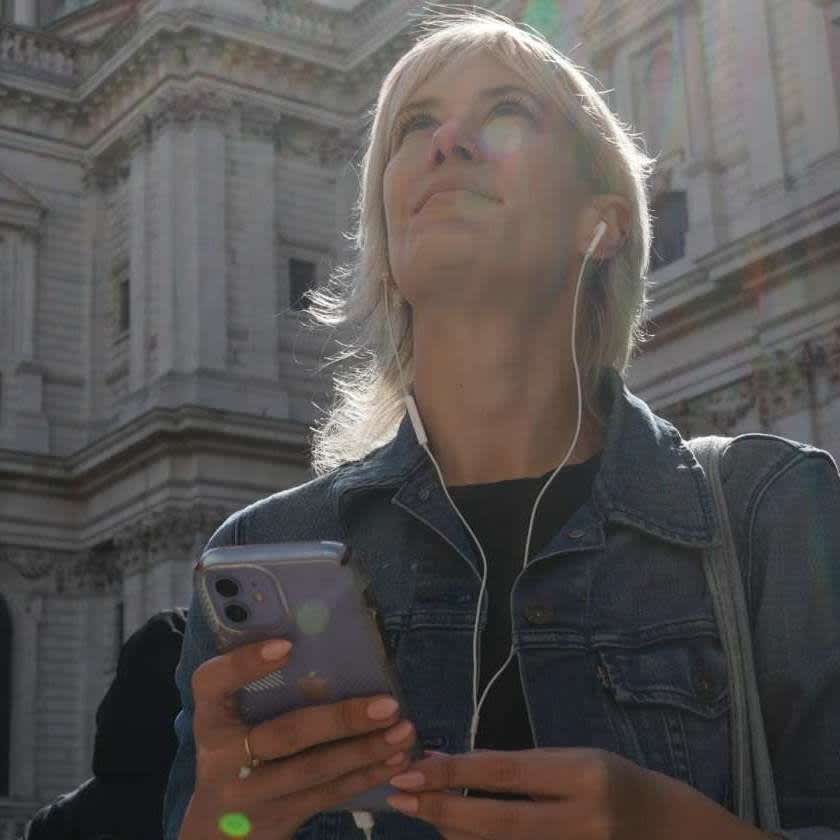 Woman listening to audio guide