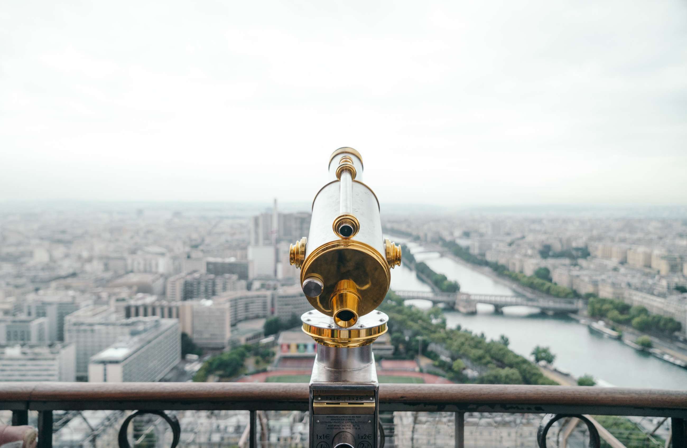A telescope overlooking Paris' River Seine
