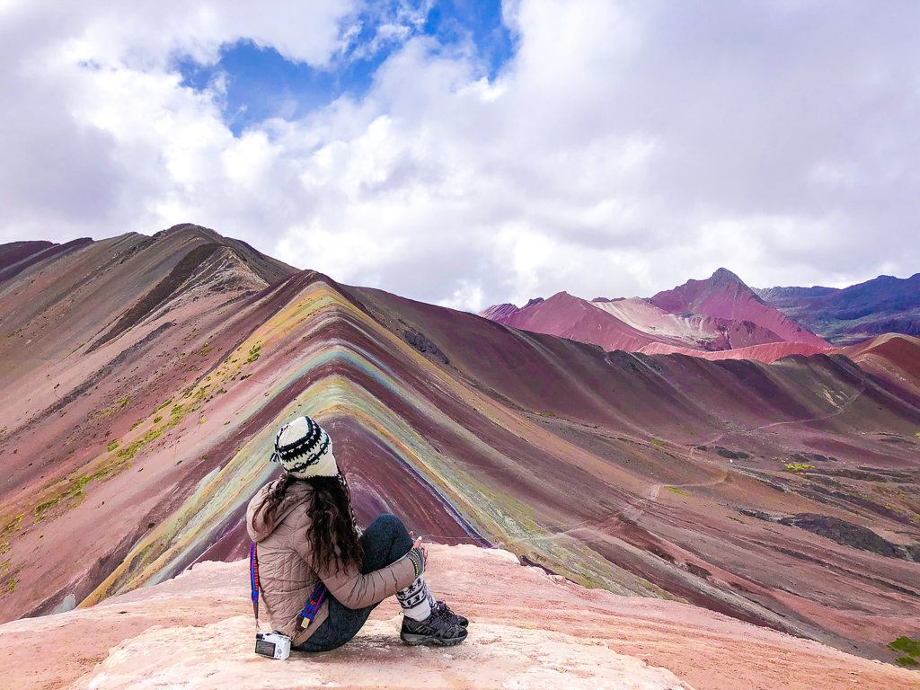 Our product manager Aashima, taking in a rainbow view of the Peruvian Andes