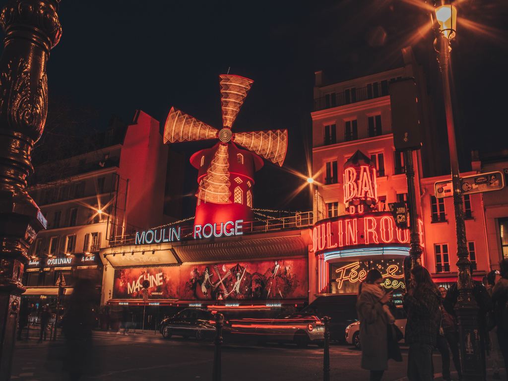 The Moulin Rouge at night in Paris.