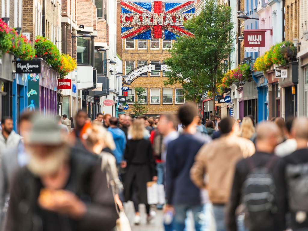 Shoppers walking through Carnaby Street, London