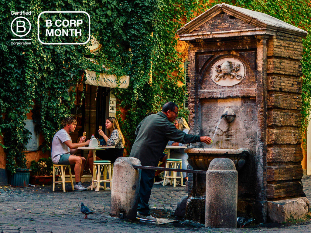 A man washes an apple at a nasoni in Rome