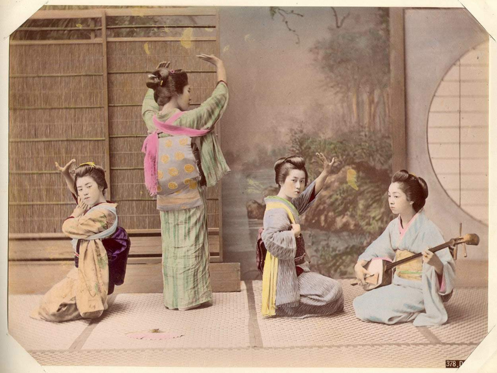 Four geisha in dance poses