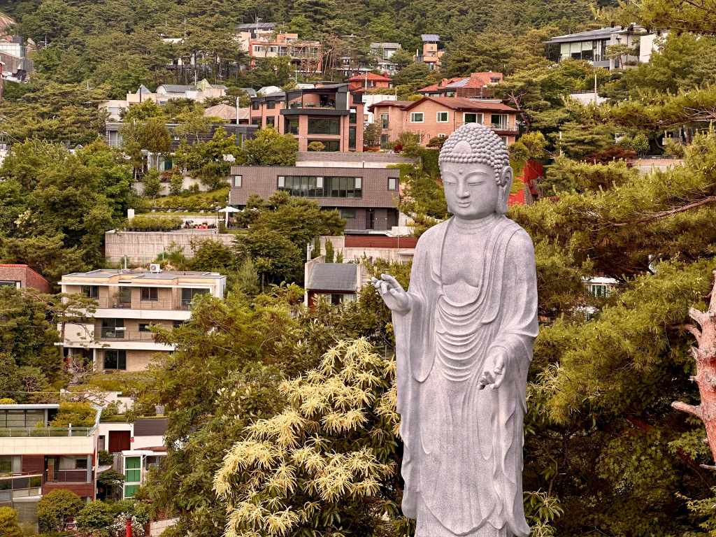 A Buddha statue overlooks the hills of Buam-dong, Seoul