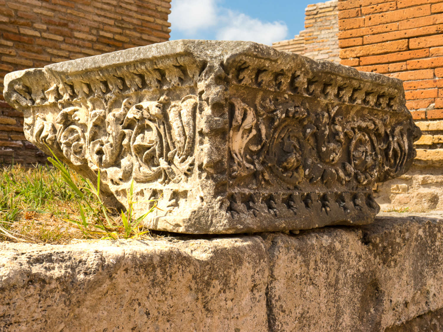 Column capital found in the Ancient Roman port city of Ostia Antica, our recommended day trip from Rome with kids