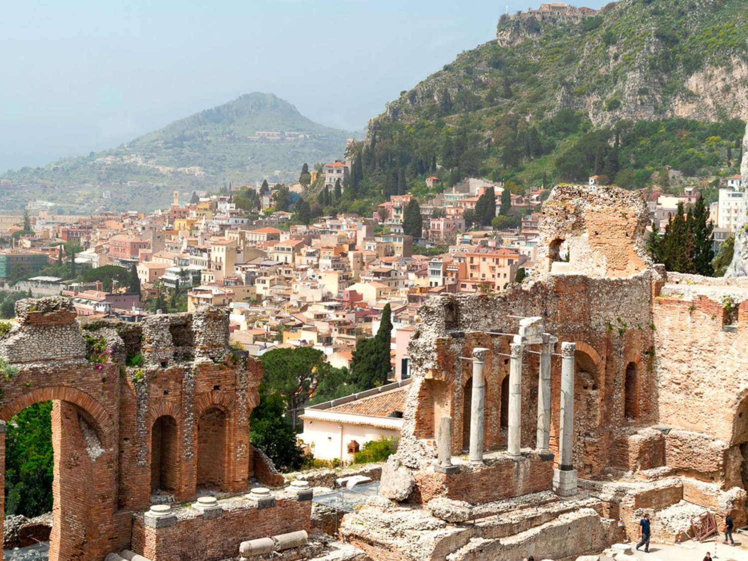 The Sicilian city of Taormina, as viewed from its Greco-Roman ruins.
