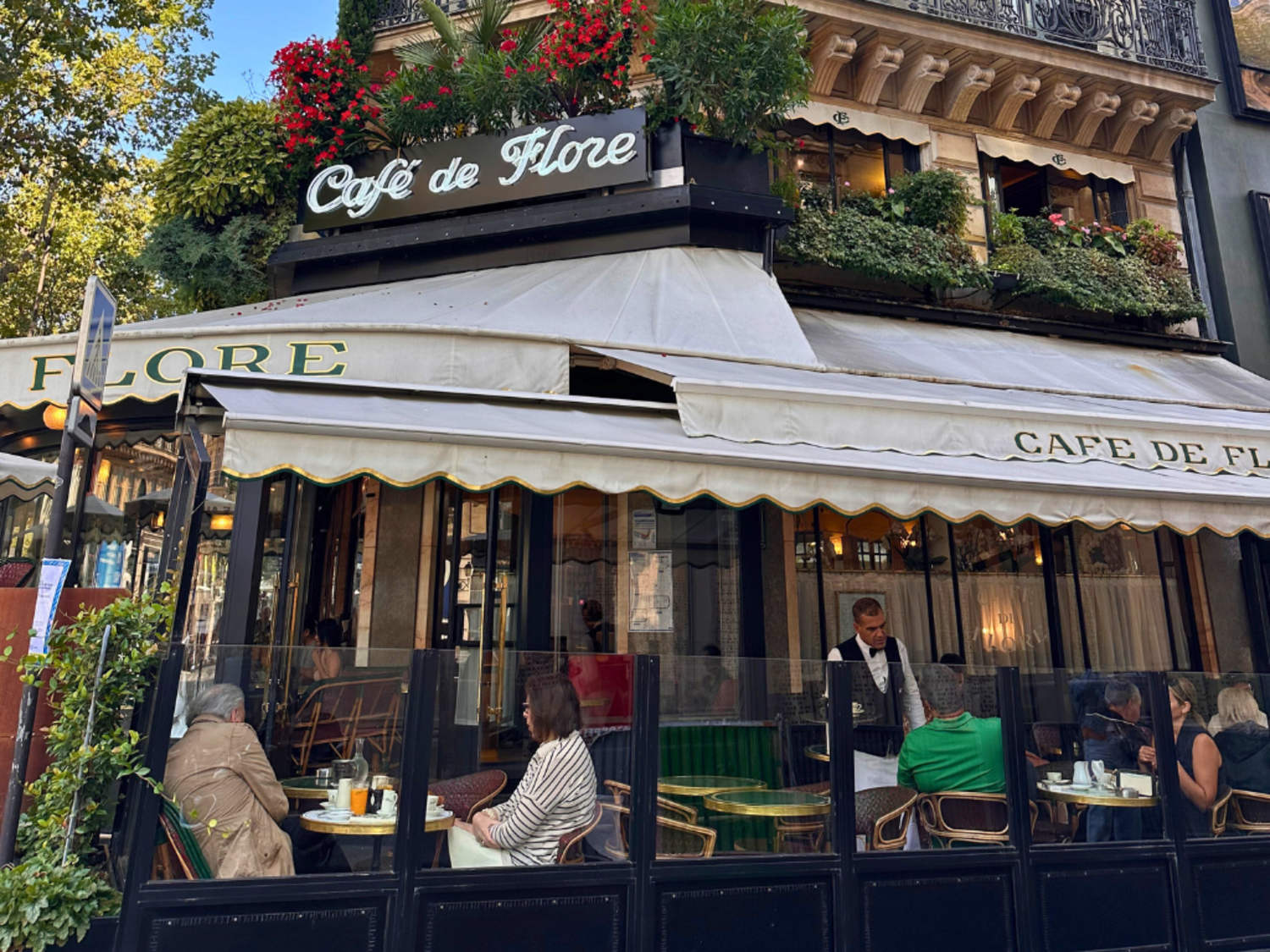 Guests eating at Cafe de Flore in Paris,